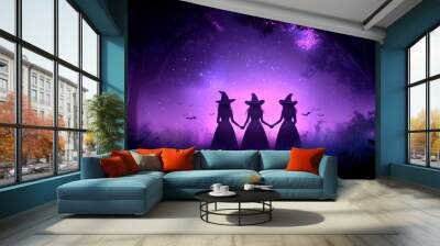 Three witches are holding hands in a forest. The witches are wearing black dresses and are surrounded by trees. Scene is mysterious and spooky Wall mural