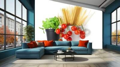 closeup of bowl with cherry tomatoes, spaghetti and basil jar on a white background Wall mural