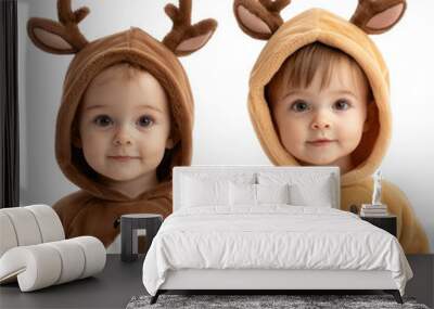 Two adorable children wearing festive animal-themed outfits with antlers, perfect for holiday-themed photography. transparent background Wall mural