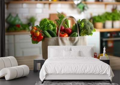 Fresh produce in reusable bag on kitchen counter Wall mural