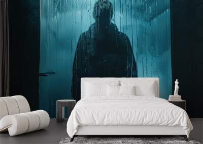 Silhouette of a person behind wet glass in the night Wall mural