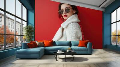 Stylish woman in sunglasses and white coat Wall mural