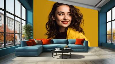 Woman smiling in yellow jacket Wall mural