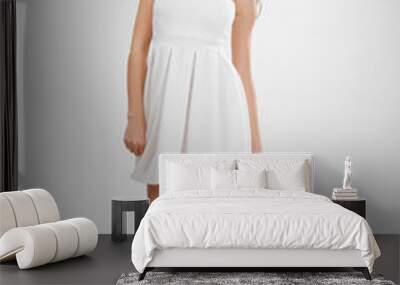 Pretty young girl in white short dress spinning around. Dynamic Wall mural