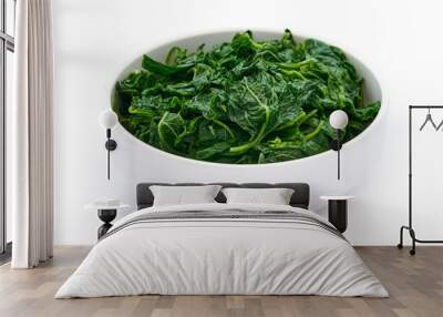 pile of green cook leaf spinach in white bowl isolated on white background. leaves spinach or heap of spinach isolated                                                     Wall mural