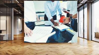 group of engineer/architect/worker man and woman discussing about building plan for construction Wall mural