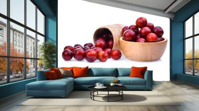 red cherry plum in wooden basket and bowl isolated on white background Wall mural