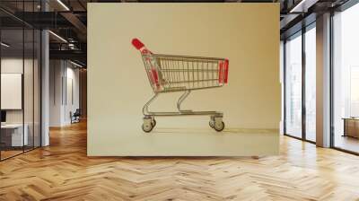 View of a shopping cart on an isolated background, Online shopping concept Wall mural