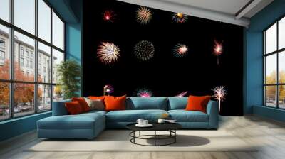 Beautiful light for celebration of Festive colorful fireworks display on night sky, isolated on black background Wall mural