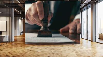 'Closed up of a businessman hand stamping a document using wooden stamp Wall mural