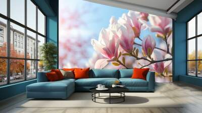 Blooming magnolia tree in the spring sun rays. Selective focus. Copy space. Easter, blossom spring, sunny woman day concept. Pink purple magnolia flowers in blue summer sky Wall mural