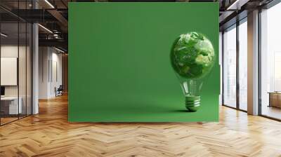 Green energy concept with Lightbulb in planet earth shape against green background Wall mural