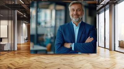 Happy middle aged business man ceo standing in office arms crossed. Smiling mature confident professional executive manager, proud lawyer, businessman leader wearing blue suit Wall mural