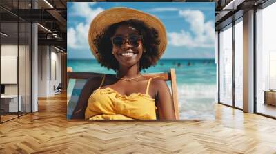 Happy Smiling African woman sitting on deck chair at beach Wall mural