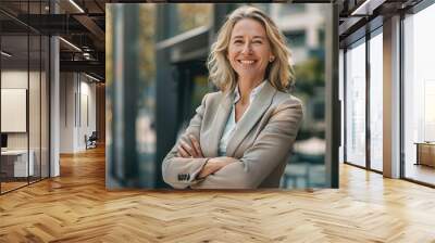 Mature confident pretty smiling professional business woman, executive entrepreneur female manager standing outside her workplace in the city Wall mural