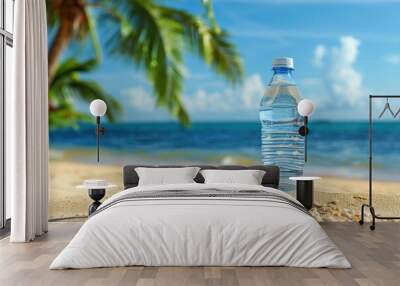 Plastic bottle on the beach with palm trees and sea background Wall mural