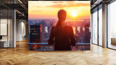 Successful woman standing on luxury balcony, back view of rich female silhouette at sunset in New York city Wall mural