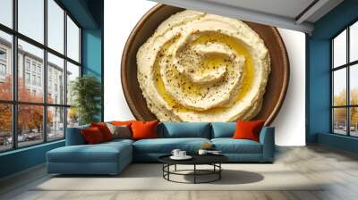 Delicious homemade hummus in wooden bowl with olive oil and pepper garnish Wall mural