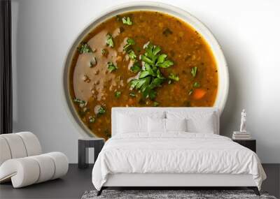 Delicious homemade lentil soup with fresh herbs in a white bowl Wall mural