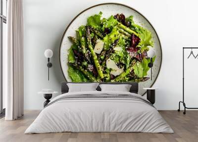 Fresh mixed green salad with asparagus and parmesan on a plate Wall mural