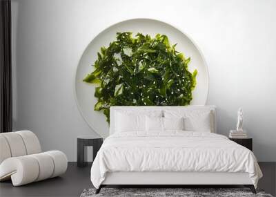 Fresh seaweed salad with sesame seeds on white plate – healthy vegan snack Wall mural