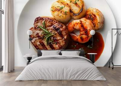 Gourmet surf and turf dish featuring grilled steak, shrimp, and scallops with sauce Wall mural