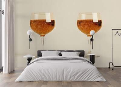 Two elegant champagne glasses filled with bubbling sparkling wine against a neutral background Wall mural