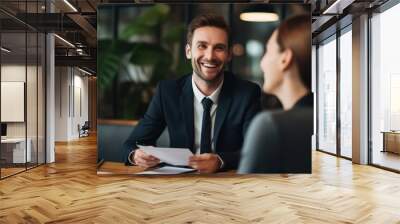 Businessman smiling in meeting  Wall mural