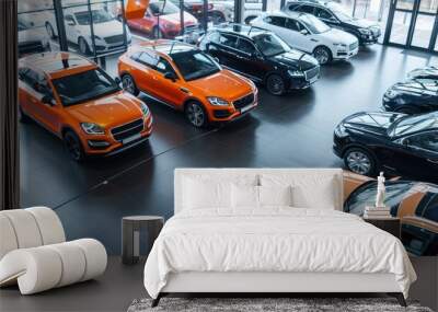 Overview of a dealership with various vehicles on display. Wall mural