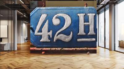 A house number plaque, showing the number fourty two (42) Wall mural