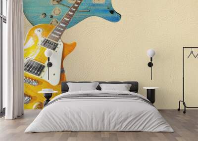 Lemon sunburst and blue electric guitar on the light skin background, with plenty of copy space. Wall mural