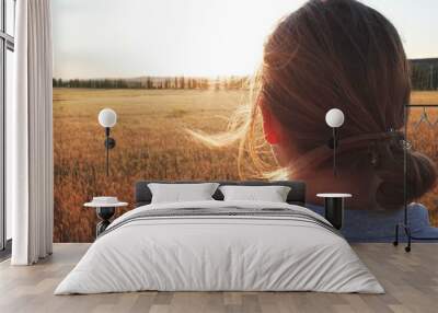 Girl in the field with blond hair Wall mural