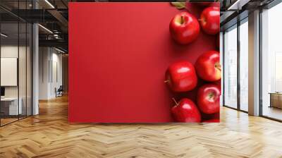 Red background with red apples Wall mural