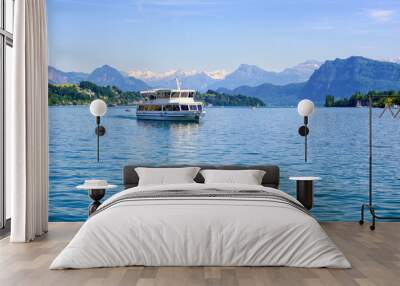 cruise ship in front of alps mountains peaks on lake lucerne, switzerland Wall mural