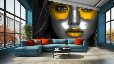 Woman wearing yellow eye makeup and sunglasses. Wall mural