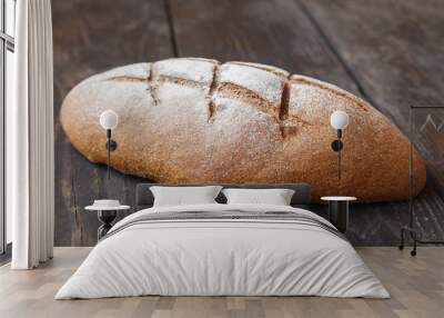 bread on a wooden table close-up Wall mural