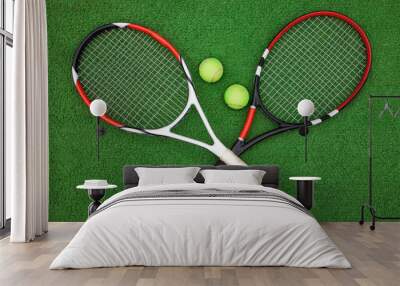 tennis racket with balls on green background Wall mural