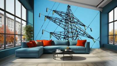 Power line against the blue sky. Hi-voltage electrical pylons Wall mural