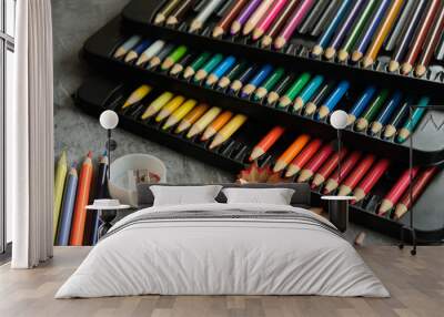 bright colored pencils on a gray background Wall mural