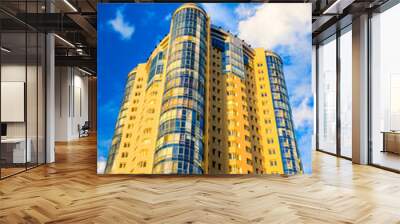 High-rise building on a background of blue sky Wall mural