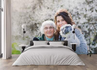 Happy Family with  Dog in the Spring Park .Family Portrait of Grandmother and Granddaughter with Dog Wall mural