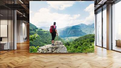 Woman Sitting on a Bench in the High Mountain Wall mural