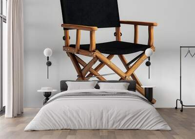 A photograph of a director s chair with a black canvas seat and wooden frame isolated on a white background  The chair is a classic minimalist design perfect for use in filmmaking photography studios Wall mural