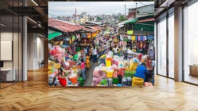 Bustling open air marketplace filled with an abundance of colorful merchandise lively vendors and eager shoppers in a dynamic urban backdrop Wall mural