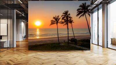 Ocean sunrise with palm tree's by the beach, Main beach Gold Coast. Wall mural