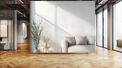 A white couch sits in front of a window with a potted plant on a table Wall mural