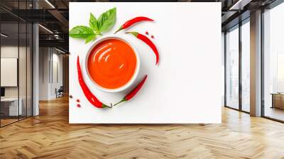 Bowl of red hot Tabasco sauce with chili peppers and leaves on white background. Concept of spicy food and condiments Wall mural