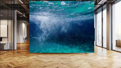 Tropical blue ocean with white bubbles underwater in Mediterranean Sea. Ocean background, underwater blue ocean background with sandy sea bottom, Blue deep water abstract natural bubble background. Wall mural