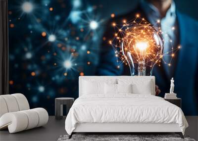 A businessman holds a light bulb, representing digital innovation technology, smart home integration, and an AI icon network connection  Wall mural