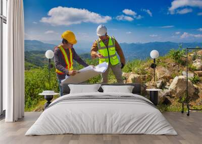 Two engineer man discuss together for the construction in far away land that cover with the forest. Wall mural